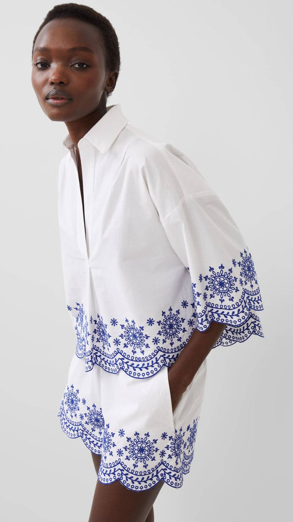 white and blue embroidered top