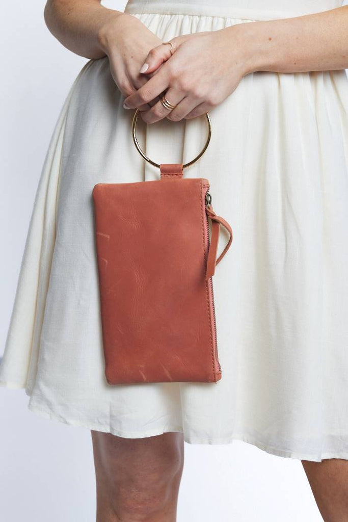 clay colored leather wristlet